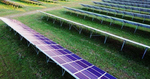 Flying low over solar power plant panels. 動画素材 169691284