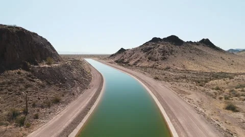 Flying low over the water in Central Arizona Project Canal Video stock 276923651