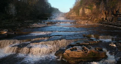 Flying low over a waterfall in the river Stock Footage 307291318