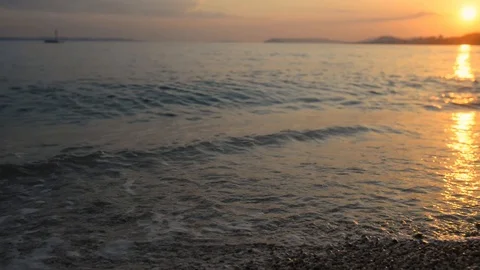 Flying low over waves coming in shore Stock Footage 107581311