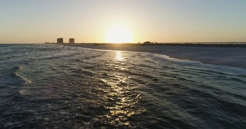 Flying low over waves, white sand beach reveals stunning sunset drone aerial 4K Stock Footage 111415768