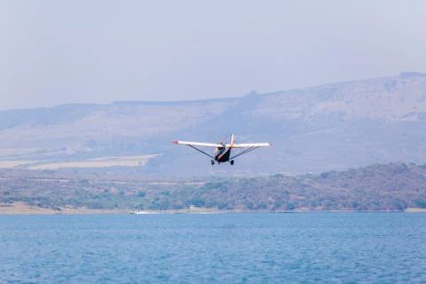 Flying Low Plane Waters Stock Photos