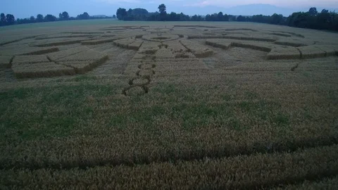Flying at low speed over a crop circle with Rubik's cubes and binary codes Stock Footage 123826930
