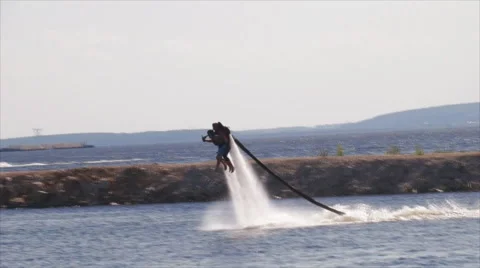 Flying man over water Stock Footage 62322642