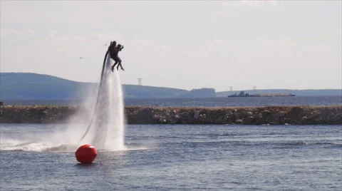 Flying man over water Stock Footage 62322657