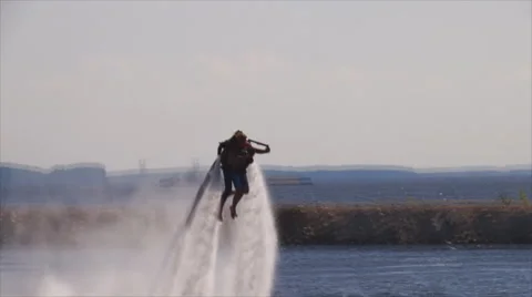 Flying man over water Stock Footage 62322670