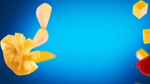 Flying of Mango and Slices in Blue Background Stock Footage 123504745