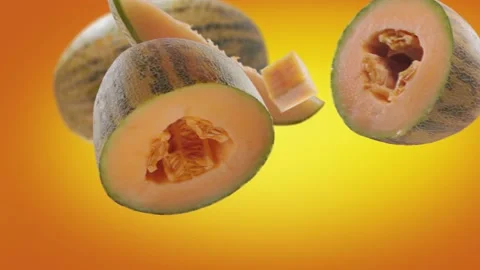Flying Melon and Melons slices in Orange Background Stock Footage 229493710