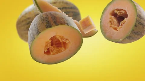 Flying Melon and Melons slices in Yellow Background Stock Footage 229561228