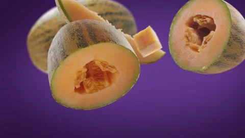 Flying Melon and Melons slices in Violet Purple Background Video stock 229565675