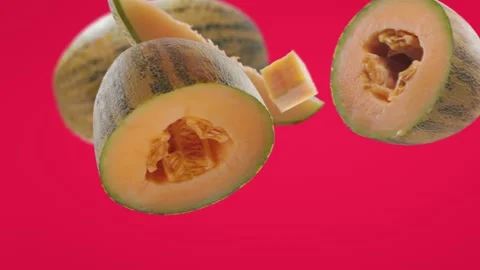 Flying Melon and Melons slices in Fuchsia Pink Background Video stock 229565967