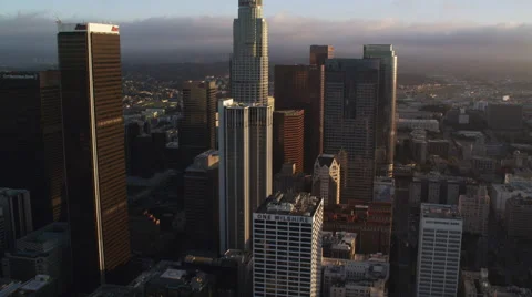 Flying by mid-level floors of skyscrapers in downtown Los Angeles; helicopter Stock Footage 59526001