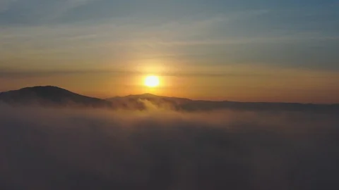 Flying in the middle of the clouds - dawn over the sea and mountains, Primorsky Stock Footage 118547470