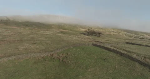 Flying up misty hills Stock Footage 296630617
