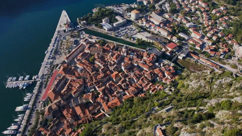 Flying from the mountain over the old town of Kotor Stock Footage 168063694