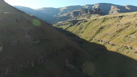 Flying into mountain pass Stock Footage 136234359