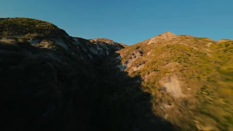 Flying Up A Mountain On A Sunny Day Stock Footage 266821389
