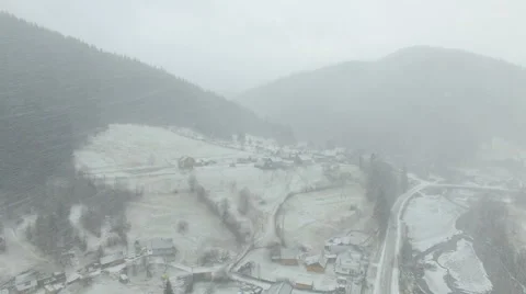 Flying in the mountains in winter. Snowstorm Stock Footage 59781075