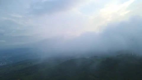 Flying up with moving clouds cover the frame Stock Footage 255018442