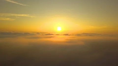 Flying moving over the clouds tranquil with golden sun in forenoon. Stock Footage 104117761