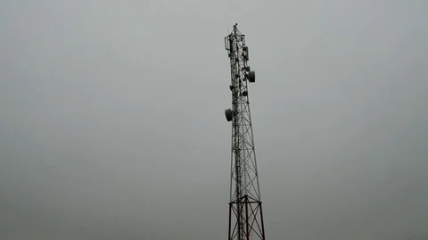 Flying near the cell tower mobile operator and the other transmitting signals Stock Footage 69737501