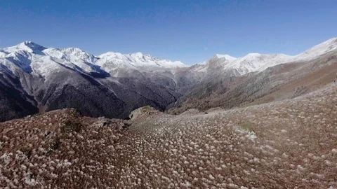 Flying near winter mountain range valley Aerial 4k video. Travel eco Tourism in Stock Footage 102040204