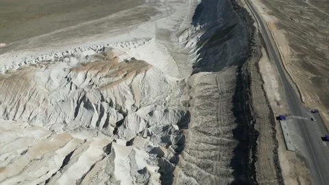Flying next to the highway with a view of the mountain desert Stock Footage 237693804