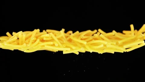 Flying noodles infront of black background in slowmotion Stock Footage 163203118