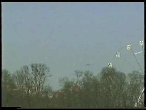 Flying Object Passing Behind Ferris Wheel Stock Footage 336300996