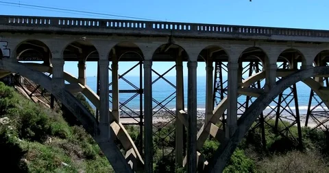 Flying by Old Highway 101 and train bridges Stock Footage 73019539