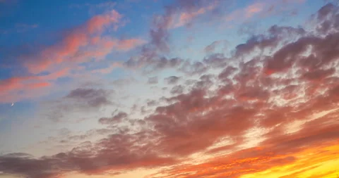 Flying orange clouds at sunset Stock Footage 138444444