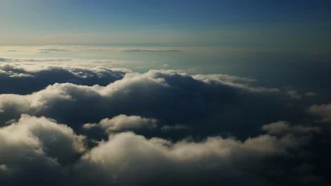 Flying out of the clouds at sunset Stock Footage 95381988