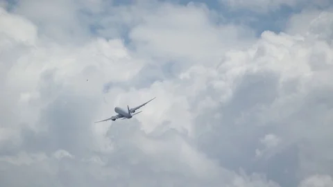 Flying out of Frame - Cathay Boeing 777 Passenger Plane Turning after Take Off Stock Footage 84118450