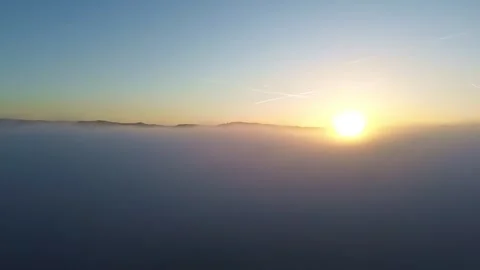 Flying out of Low Hanging Clouds at Sunset 4k Drone Stock Footage 294097638
