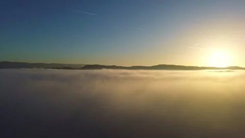Flying out of Low Hanging Clouds at Sunset 4k Drone Stock Footage 294097968