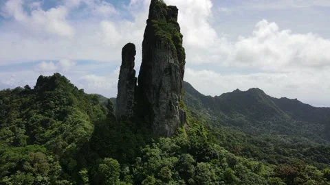 Flying out from the Needle, highest point in Rarotonga Stock Footage 203928771
