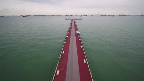 Flying out to Open Seas from Bedok Jetty, Singapore Stock Footage 275892641