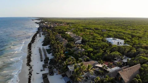 Flying out to sea at Tulum Beach at sunset Stock Footage 94327062