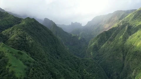 Flying out of valley on Mount Aorai, Tahiti French Polynesia Stock Footage 253171754