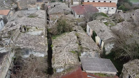 Flying over an abandoned and destroyed village after earthquake Stock-Footage 123896971