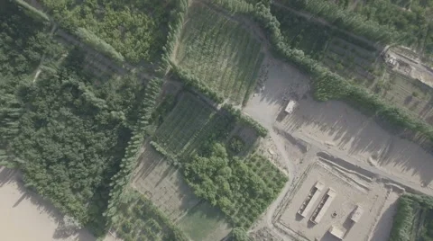 Flying over agricultural fields in remote desert near Dunhuang, China Stock Footage 67519602