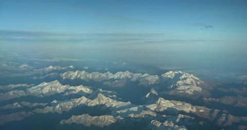 Flying over the Alps during summer season. Aerial view from the airplane window. Stock Footage 119005823