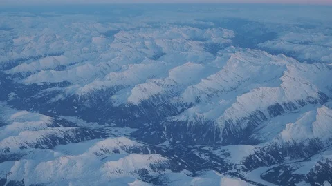 Flying over the Alps during the sunset in winter time. Fresh snow Stock Footage 120619312