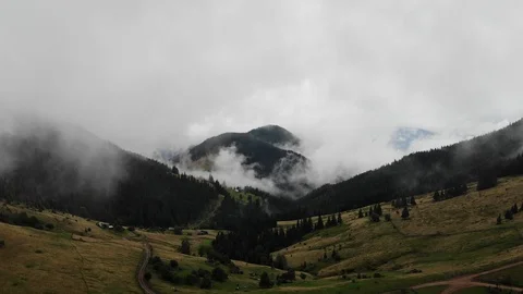 Flying over an amazing rain forest and field  over which the fog evaporates. Stock Footage 117519712