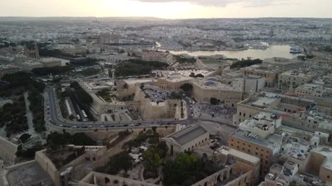 Flying over the ancient town with many old buildings in sunset light. Stock Footage 163538228