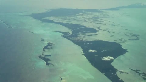 Flying over The Bahamas. Beautiful ocean colors. Actual aerial footage. Stock Footage 145500962