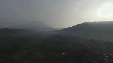 Flying Over the Bali Forest Looking Around the Mountains with Sunrise 動画素材 237166889
