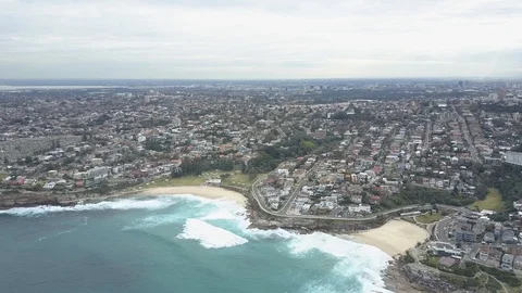 Flying over a beach with a city in the background 2 Video stock 106592063