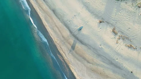 Flying Over The Beach During A Calm Sunny Day Stock Footage 310695776