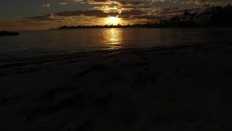 Flying over a beach with sunset, Bahamas Stock Footage 73460740